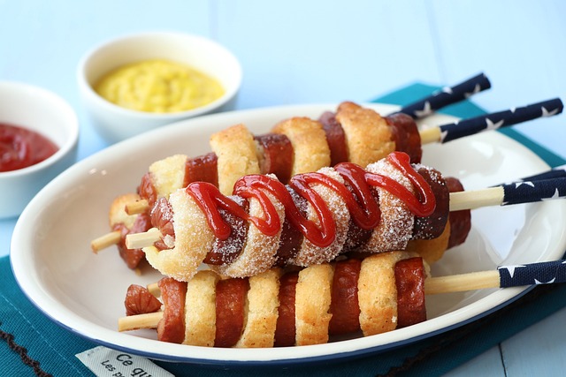 hot dogs, sausage, ketchup, twisted hotdogs, tornado dogs, whirlwind hot dog, meal, dish, plate, hot dogs, hot dogs, sausage, ketchup, ketchup, ketchup, ketchup, ketchup